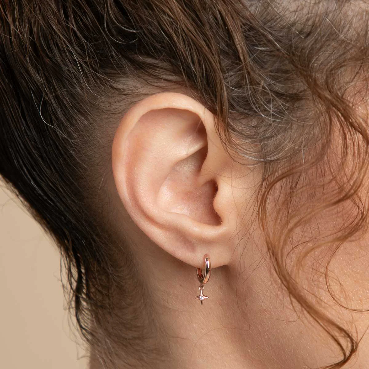 Cosmic Star Charm Huggies in Rose Gold - Image 2