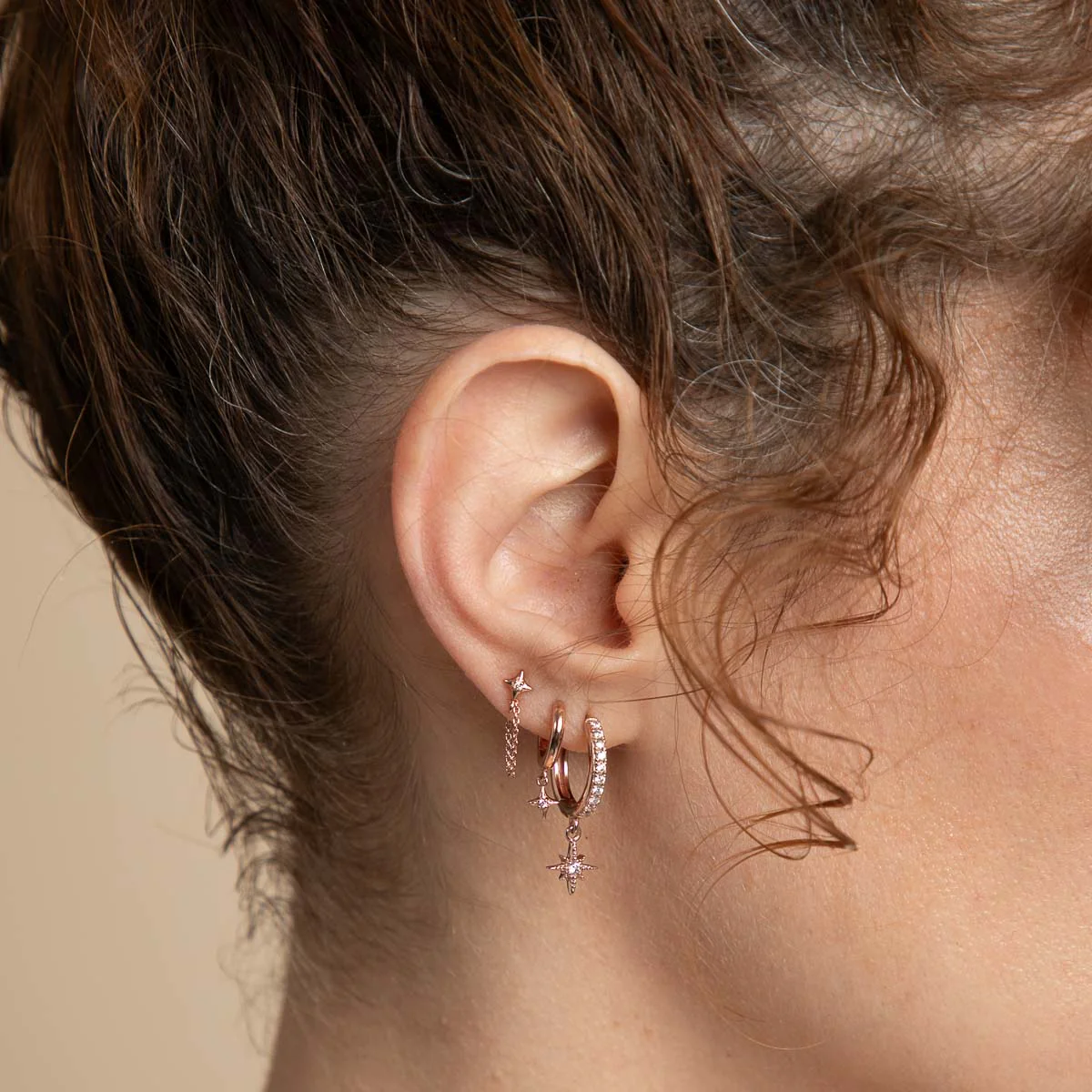 Cosmic Star Charm Huggies in Rose Gold - Image 3