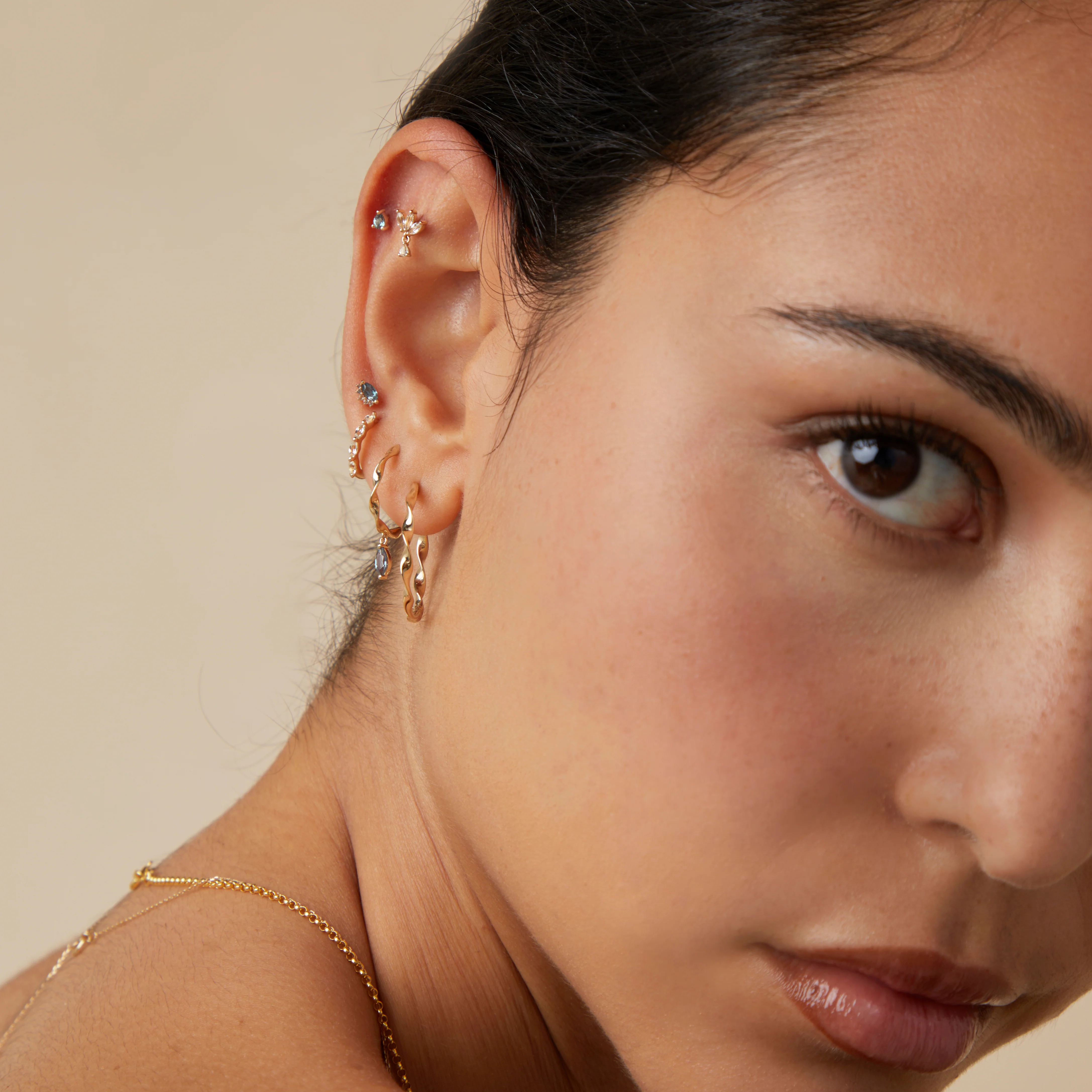 White Topaz Marquise Huggies in Solid Gold - Image 4