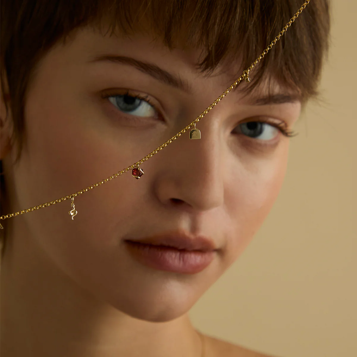 White Topaz Snake Charm 9k Gold - Image 4
